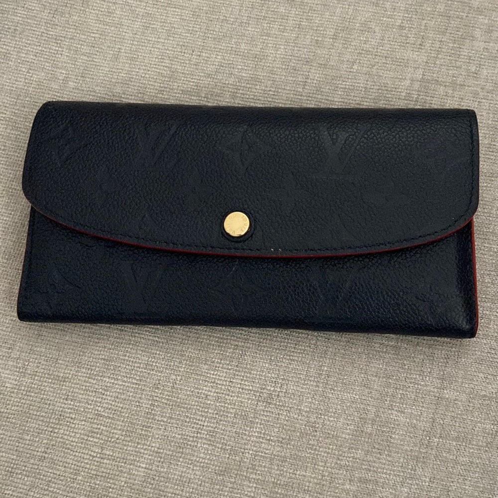 Louis Vuitton Navy Wallet. Less than a year old and gently used.